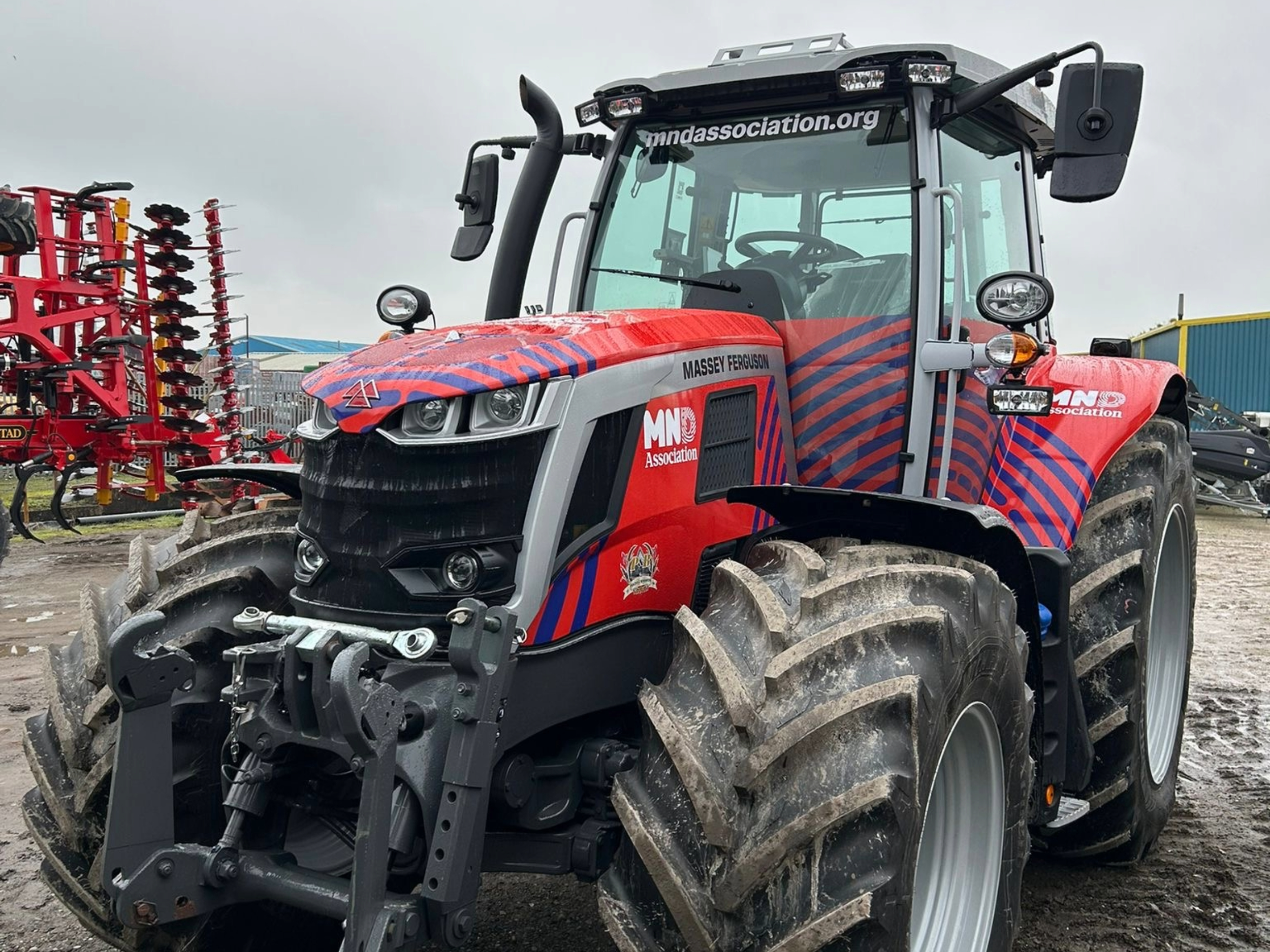A Massey Ferguson tractor wrapped in MND Association colours 